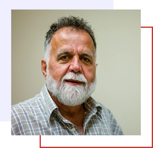 A man with a beard and mustache wearing a shirt